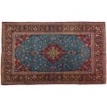 A KESHAN PART SILK RUG, PERSIA, MODERN the sky-blue field with a floral red and green medallion