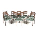 A SET OF TEN REGENCY STYLE MAHOGANY DINING CHAIRS comprising: eight side chairs and a pair of