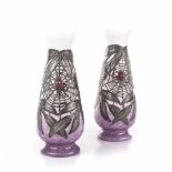 A PAIR OF ART NOUVEAU GLASS VASES each with tapering ovoid body and flared rim, the purple base