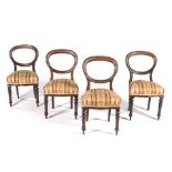 A SET OF FOUR VICTORIAN WALNUT BUSTLEBACK SIDE CHAIRS each moulded open frame back above a