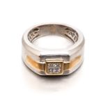 A DIAMOND RING, BROWNS the broad two tone band bezel-set to the centre with four princess-cut