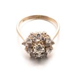 A DIAMOND CLUSTER RING centred with a round brilliant-cut diamond weighing approximately 0.28cts,