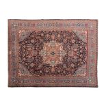 A KHOROSSAN CARPET, PERSIA, MODERN the dark blue field with an ivory and cinnamon floral