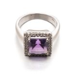 AN AMETHYST AND DIAMOND RING centred with a square step-cut amethyst weighing approximately 1.53cts,