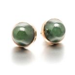 A PAIR OF JADE-LIKE STONE EAR STUDS each centred with a circular cabochon jade-like stone, within