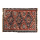 A SOUMAK FLATWEAVE CARPET, EAST CAUCASUS, CIRCA 1900 the red field with three blue and red