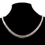 A DIAMOND NECKLACE designed as a double line of claw-set round brilliant-cut diamonds, graduating in
