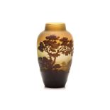 A GALLE ACID-ETCHED CAMEO GLASS VASE, CIRCA 1900 depicting a lake scene with trees, in shades of