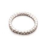 A FULL DIAMOND ETERNITY RING claw-set throughout with round brilliant-cut diamonds weighing
