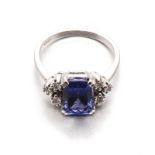 A TANZANITE AND DIAMOND RING centred with a mixed-cut tanzanite weighing approximately 2.87cts,