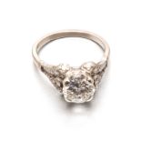 A DIAMOND RING centred with a round brilliant-cut diamond weighing approximately 1.55cts in total,