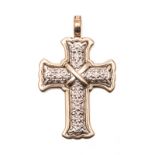 A 9CT GOLD AND SILVER PENDANT in the form of a cross, the centre composed of silver, embellished