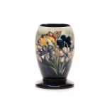 A WILLIAM MOORCROFT ‘’SPRING FLOWERS’’ PATTERN VASE, CIRCA 1936 of tapering cylindrical form on a