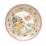 A CHINESE FAMILLE ROSE CHARGER, QIANLONG 1736 - 1795 the centre decorated with figures before a