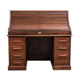 A ROLL-TOP DESK, LATE 19TH CENTURY the rounded rectangular top above a tambour door enclosing