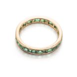 A FULL EMERALD ETERNITY RING channel-set with carré-cut emeralds weighing approximately 1.82cts in