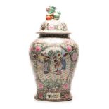 A CHINESE FAMILLE ROSE URN WITH COVER the tapering baluster body painted with panels depicting