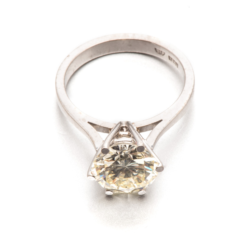 A DIAMOND SOLITAIRE RING claw-set with a round brilliant-cut diamond weighing approximately 3.29cts,