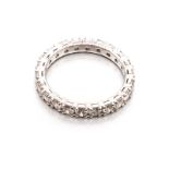 A FULL DIAMOND ETERNITY RING claw-set throughout with round brilliant-cut diamonds weighing