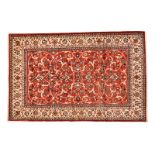 AN ISPAHAN CARPET, PERSIA, MODERN the red field with an overall design of multicoloured scrolling