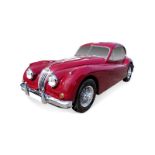 A 1955 JAGUAR XK 140 FHC 3.4 litre motor, colour: imperial maroon with tan leather biscuit interior,