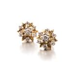 A PAIR OF DIAMOND EAR STUDS each of flower deign, centred with a round brilliant-cut diamond