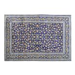 A KESHAN CARPET, PERSIA, MODERN the deep indigo-blue field with overall multicoloured palmettes,