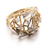 A 9CT GOLD AND DIAMOND RING of abstract cage design, composed of geometric shapes, embellished