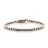 A DIAMOND TENNIS BRACELET each square-shaped link millegrain set with a round brilliant-cut