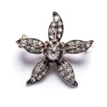 A VICTORIAN DIAMOND BROOCH in a floral design set with old cut diamonds in white and yellow gold