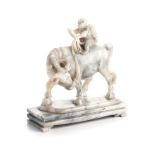 A CHINESE CARVED HARDSTONE 'BOY AND BUFFALO' GROUP the child astride a buffalo, gripping onto a rope