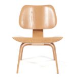 A PLYWOOD LCW CHAIR DESIGNED BY CHARLES AND RAY EAMES MANUFACTURED BY VITRA the curved back and seat