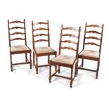 A SET OF FOUR OAK LADDERBACK SIDE CHAIRS each ladderback between block-and-turned supports