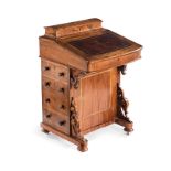 A VICTORIAN MAHOGANY AND SATINWOOD DAVENPORT the rectangular top surmounted by a stationary