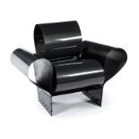 A BAD TEMPERED GLASS CARBON AND KEVLAR FIBRE RESIN ARMCHAIR DESIGNED IN 1985 BY RON ARAD