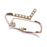 A 9K YELLOW GOLD AND DIAMOND BANGLE a hinged bangle with a tube set round brilliant-cut diamond