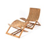 A NORWEGIAN BEECH AND WEBBED CHAIR AND FOLDING OTTOMAN DESIGNED IN THE 1970s BY INGMAR RELLING FOR