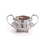 A GEORGE IV IRISH SILVER TWO-HANDLED SUGAR BASIN, EDWARD TWYCROSS, DUBLIN, 1827 of lobed, baluster