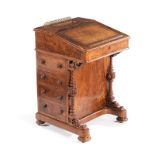 A VICTORIAN WALNUT AND SATINWOOD DAVENPORT the rectangular inlaid top centered by a stationary