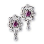 A PAIR OF 18K WHITE GOLD, RUBY AND DIAMOND CLUSTER EARRINGS each ruby surrounded by eight old cut