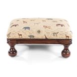 A MAHOGANY AND UPHOLSTERED OTTOMAN the rectangular closenailed and padded top above a moulded