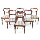 A SET OF SIX VICTORIAN DINING CHAIRS each shaped top rail above a reeded carved mid-rail, drop-in