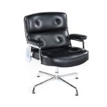 A LEATHER AND CHROME LOBBY ARMCHAIR DESIGNED IN 1960 BY CHARLES AND RAY EAMES FOR VITRA the padded