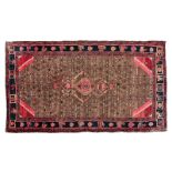 A HAMADAN CARPET, PERSIA, MODERN condition: fair, colour run, repair 285 by 155cm