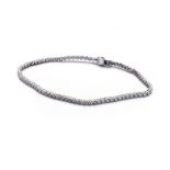 AN 18K WHITE GOLD TENNIS BRACELET the claw-set diamonds totaling approximately 2.20ct, colour I,