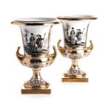 A PAIR OF BAVARIAN TWO-HANDLED URNS, 19TH CENTURY each with flaring trumpet mouth, applied with