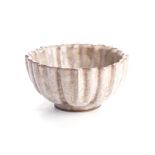 A CHINESE GUAN WARE ‘LOTUS’ BOWL the curved sides divided into eight facets rising from a high