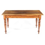 A CAPE BLACKWOOD DINING TABLE the rectangular top above a plain frieze, on turned tapering legs,