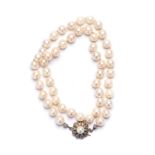 A SINGLE STRAND PEARL NECKLACE of fifty pearls approximately 7mm to 7,4mm in diameter, the clasp