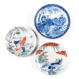 A MISCELLANEOUS COLLECTION OF THREE JAPANESE PLATES one painted with a pair of carp swimming amongst